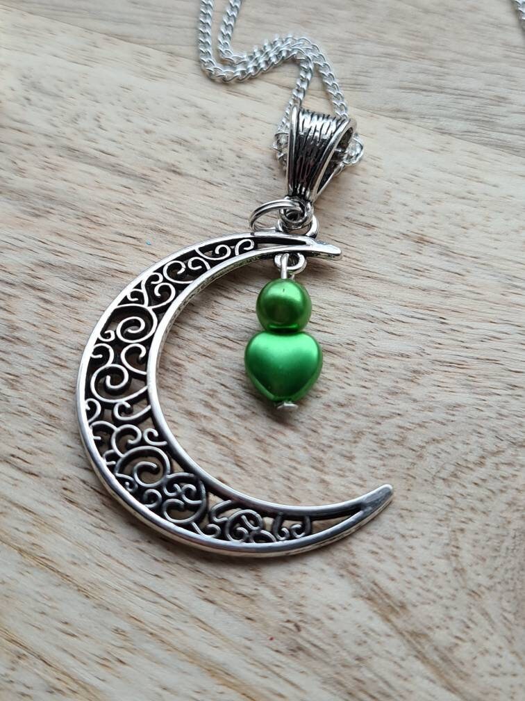 Crescent moon pendant with heart drop