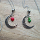 Crescent moon pendant with heart drop