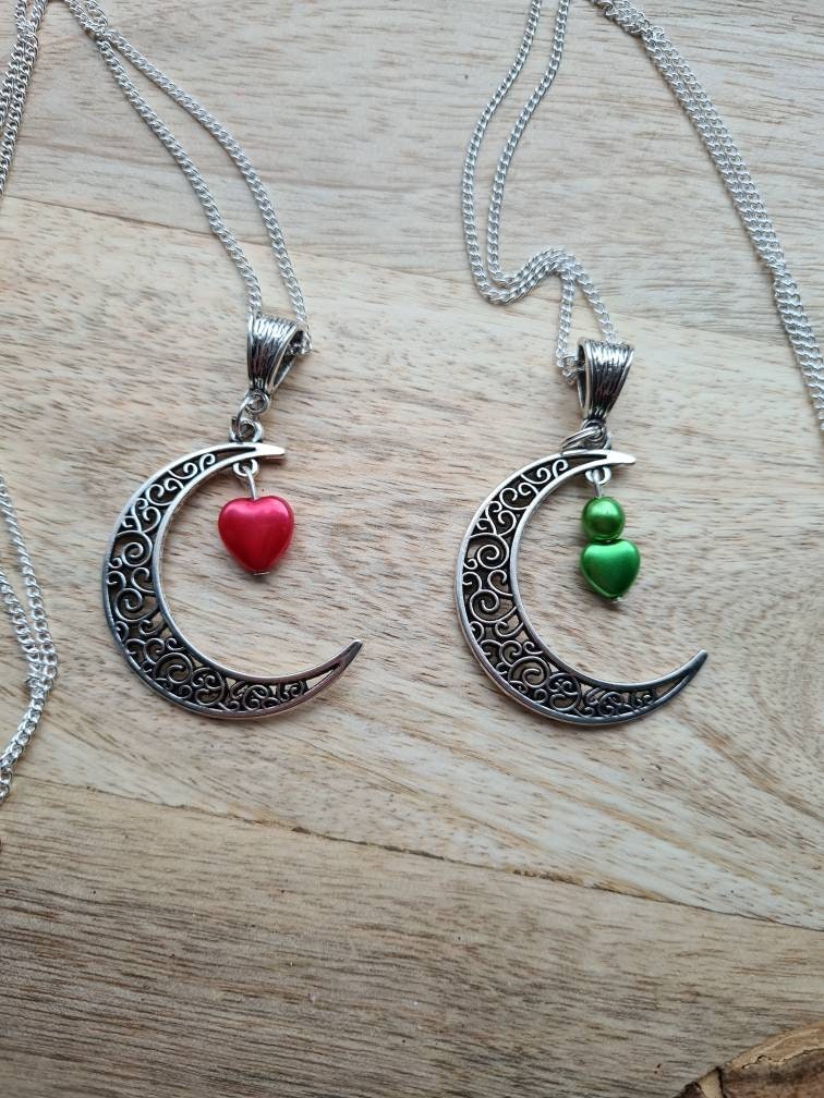 Crescent moon pendant with heart drop