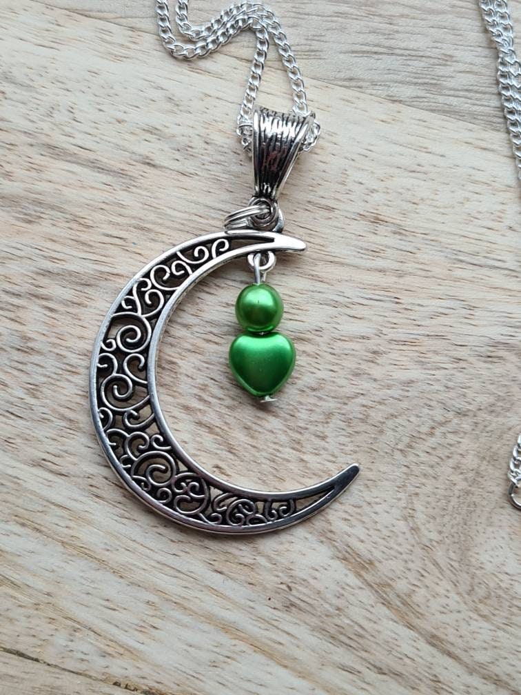 Crescent moon pendant with heart drop